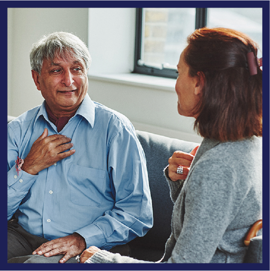 A person communicating with an interpreter.