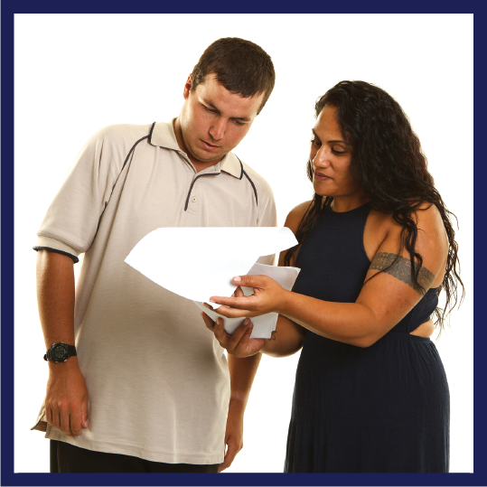 A person helping someone else to read a document.