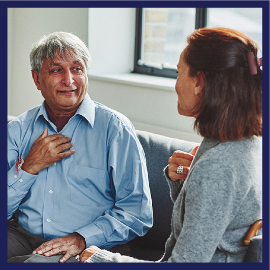 A person communicating with an interpreter.